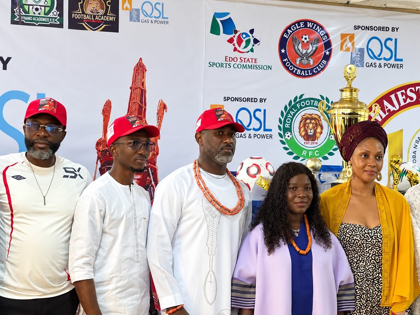 Chiefs and guests in front of the tournament sponsor banners