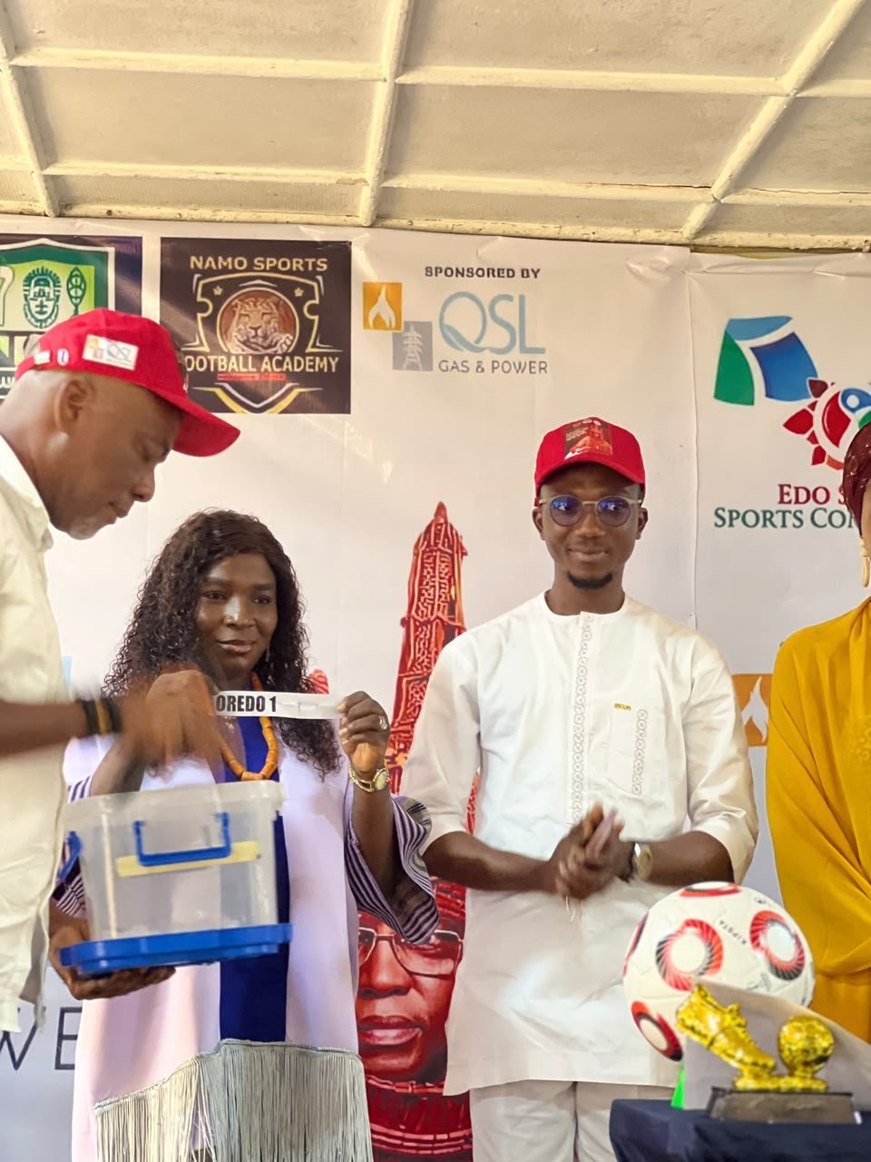 Drawing a team at the Draws and Press Parley under the QSL sponsor banner